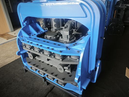 Hydraulic Pile Driver with Integrated Control Valve Assembly and Dual Pump Flow Merging System